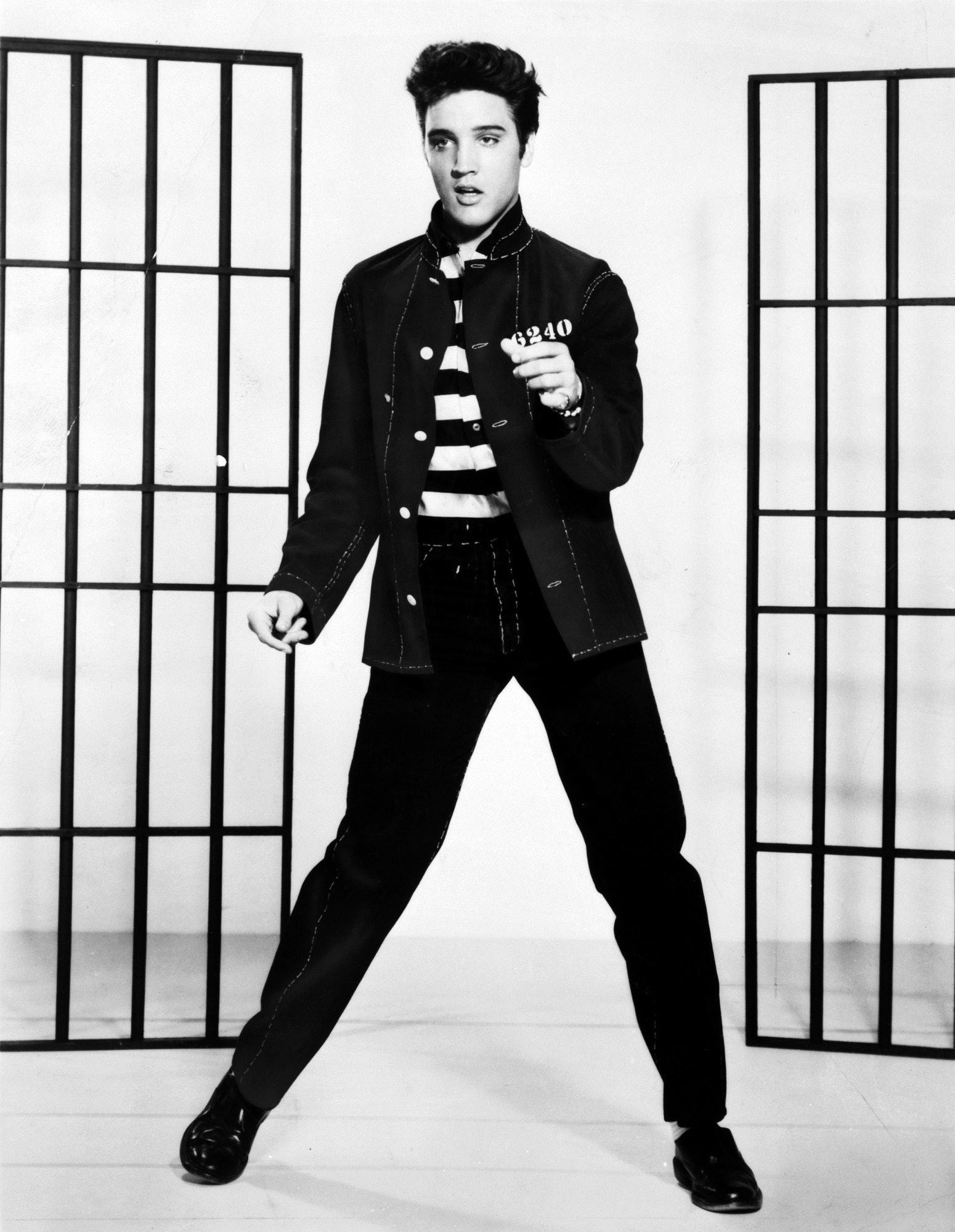 Why did Elvis wear high collars? 