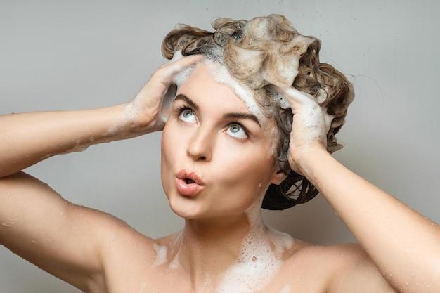 How can I wash my hair without getting my eyebrows wet? 