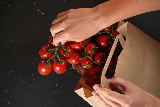 Why do tomatoes ripen in a paper bag? 