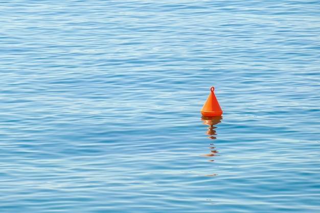 What does a red cone shaped buoy mark 