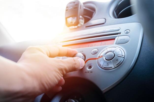 What should you do when listening to your car radio 