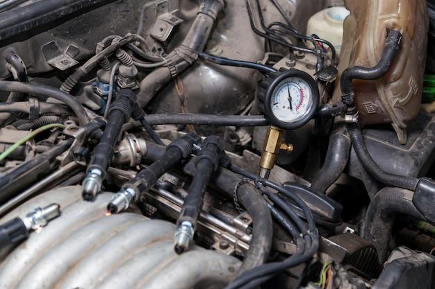 Where is the fuel pressure control valve located? 