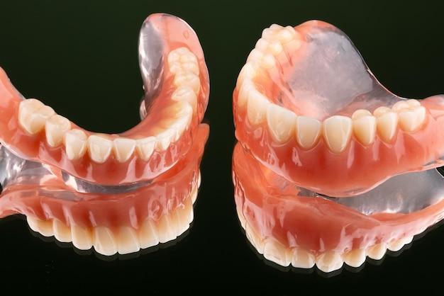 Why do my dentures look like buck teeth? 