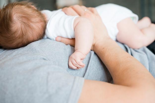 Why does my baby hold onto my shirt while sleeping? 